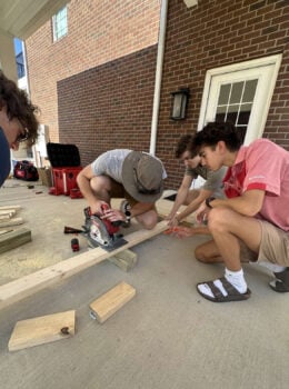 New Members Gather to Help Build Tables