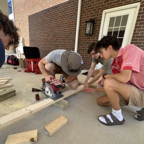 New Members Gather to Help Build Tables