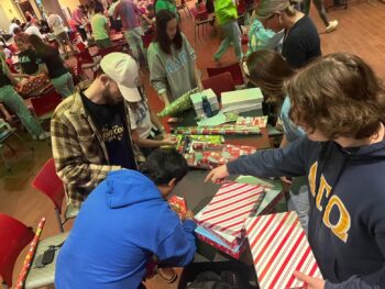 BROTHERS GIVE BACK TO THE COMMUITY BY WRAPPING PRESENTS FOR CHILDREN