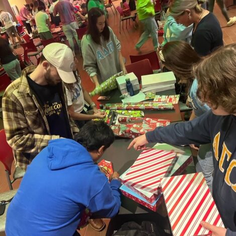 BROTHERS GIVE BACK TO THE COMMUITY BY WRAPPING PRESENTS FOR CHILDREN