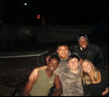BROTHERS AND SWEETHEART TAKE PICTURE AFTER BROTHERHOOD BONFIRE