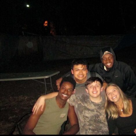 BROTHERS AND SWEETHEART TAKE PICTURE AFTER BROTHERHOOD BONFIRE