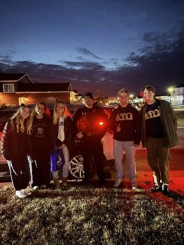 Trick or treat for spare change with Alpha Gamma Delta