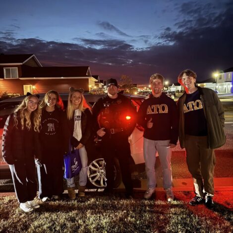 Trick or treat for spare change with Alpha Gamma Delta