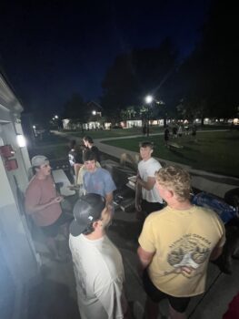 Brothers Eat Raising canes outside chapter house