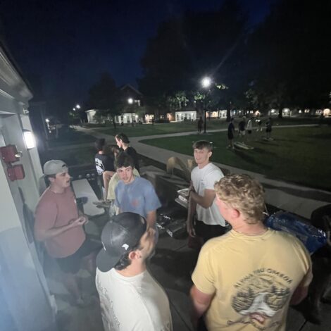 Brothers Eat Raising canes outside chapter house