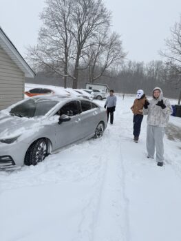 Brothers help Neighbor push car