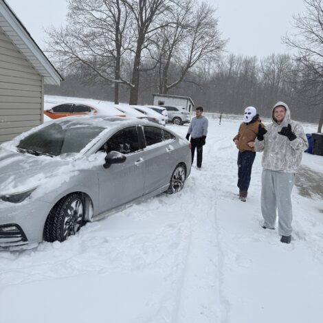 Brothers help Neighbor push car