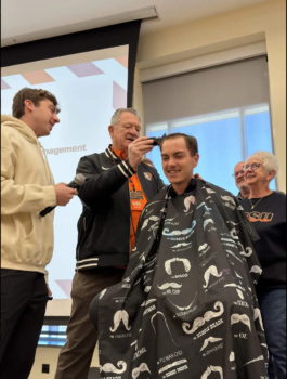 President Rogers cuts Brothers Hair