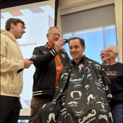 President Rogers cuts Brothers Hair